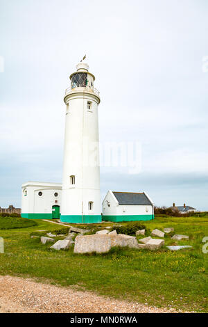 Hurst Point Lighthouse is located at Hurst Point in the English county of Hampshire, and guides vessels through the western approaches to the Solent.  Stock Photo