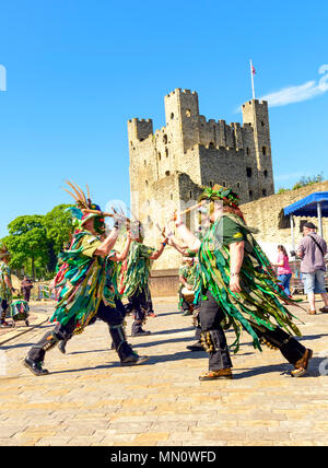 A side of border morris dancers performing in front of Rochester castle Stock Photo