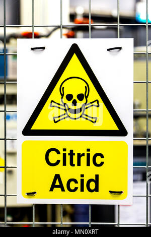 Toxic hazard danger yellow triangle sign with a skull for citric acid Stock Photo