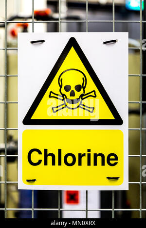 Toxic hazard danger yellow triangle sign with a skull and crossbones for chlorine Stock Photo