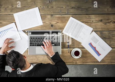 Business man working with laptop and statistics data Stock Photo