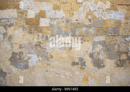 Limestone, sandstone brown, grey background. Weathered, peeled, vintage, empty wall for backdrop. Close up view with details. Stock Photo