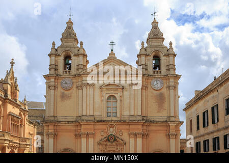 St Paul and Peter cathedral in Mdina, Malta. Catholic church under cloudy sky background. Ideal destination for pray and tourism. Stock Photo