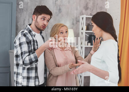 Cheerless young people having a conflict Stock Photo