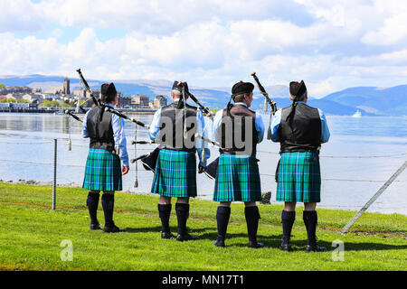 Gourock, UK. 13th May 2018. Gourock starts off the 'Games' season with hundreds of pipers, 'heavies' and dancers from across the country, all competing in traditional Scottish Highland Games that include pipe bands, individual piping, country dancing for all ages and all the traditional heavyweight competitions such as tossing the caber, throwing the hammer and lifting the Keppoch Stone.Thousands of spectators turned out on a fine sunny May Sunday to cheer on all the competitors. Credit: Findlay/Alamy Live News Stock Photo