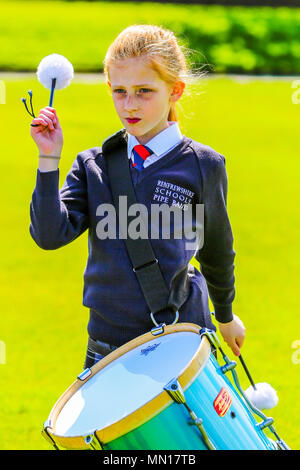 Gourock, UK. 13th May 2018. Gourock starts off the 'Games' season with hundreds of pipers, 'heavies' and dancers from across the country, all competing in traditional Scottish Highland Games that include pipe bands, individual piping, country dancing for all ages and all the traditional heavyweight competitions such as tossing the caber, throwing the hammer and lifting the Keppoch Stone.Thousands of spectators turned out on a fine sunny May Sunday to cheer on all the competitors. Credit: Findlay/Alamy Live News Stock Photo