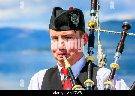 Gourock, UK. 13th May 2018. Gourock starts off the 'Games' season with hundreds of pipers, 'heavies' and dancers from across the country, all competing in traditional Scottish Highland Games that include pipe bands, individual piping, country dancing for all ages and all the traditional heavyweight competitions such as tossing the caber, throwing the hammer and lifting the Keppoch Stone.Thousands of spectators turned out on a fine sunny May Sunday to cheer on all the competitors. Credit: Findlay/Alamy Live News Stock Photo