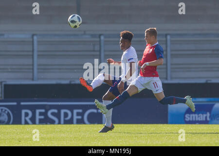 Burton, UK. 13th May, 2018. Burton, UK. 13th May, 2018. Ethan Laird (England) clears the ball under the close attention of Kornelius Normann Hansen (Norway) during the 2018 UEFA European Under-17 Championship Quarter Final match between England and Norway at Pirelli Stadium on May 13th 2018 in Burton upon Trent, England. (Photo by Richard Burley/phcimages.com) Credit: PHC Images/Alamy Live News Credit: PHC Images/Alamy Live News Stock Photo