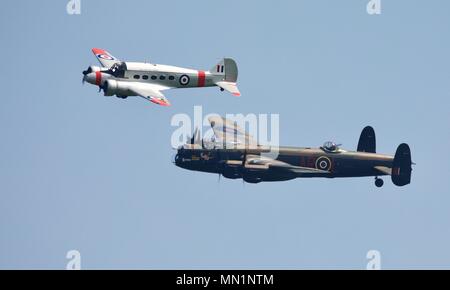 Avro C19 Anson and the BBMF Avro Lancaster performing a rare flypast together at Shuttleworth Season premiere airshow in 2018 Stock Photo