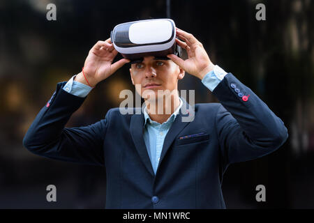 Young handsome businessman exploring the city Stock Photo