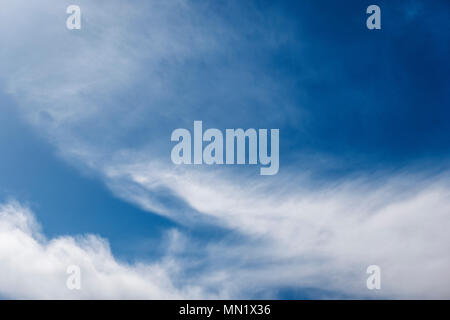 Cirrus clouds against a clear blue azure Colorado sky Stock Photo