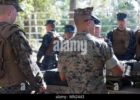 Marine Corps Engineer School is a United States Marine Corps institution focused on combat engineering and demolitions training. Career Orientation and Training for Midshipmen (CORTRAMID) introduces students to Marine Corps capabilities. The archival image records a demolitions instruction class at Camp Lejeune, North Carolina, in August 2017. Stock Photo