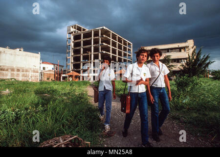 Managua, Nicaragua, June 1986; School boys on their way home from school as storm clouds gather in central Managua. Stock Photo