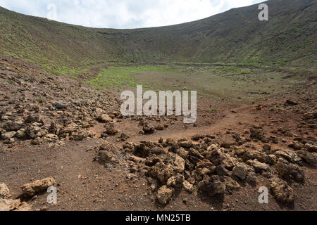 LANZAROTE, CANARY ISLANDS, SPAIN: Caldera of an old volcano in the spectacular volcanic landscape of the Timanfaya national park. Stock Photo