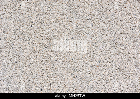 White wall background made from concrete and small stones. Stock Photo