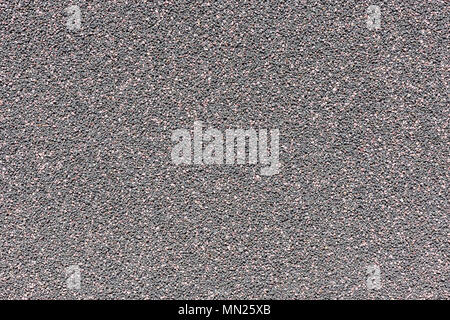 Colorful wall background made from concrete and small stones. Stock Photo