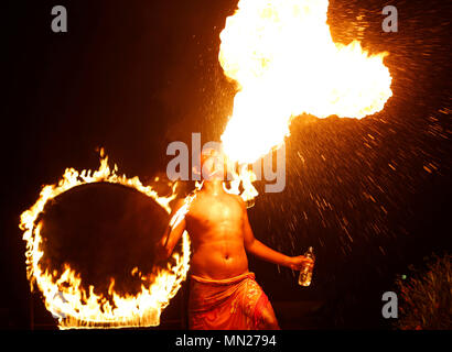 Pandeglang, Indonesia. 13th May, 2018. A dancer performance fire dance during Rhino Kites Festival Tanjung Lesung Festival 2018 at Beach Club area in Tanjung Lesung Hotel and Resort Pandeglang, Banten province, Indonesia. Rhino Kites Festival Tanjung Lesung Festival 2018 will be held on May 12 - 13 this week supported by Tanjung Lesung Hotel and Resort. Credit: Dadang Tri/Pacific Press/Alamy Live News Stock Photo