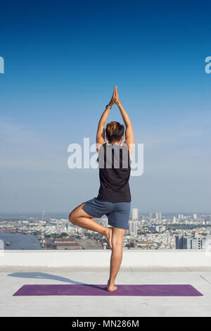Man practicing advanced yoga. A series of yoga poses. lifestyle concept. Stock Photo