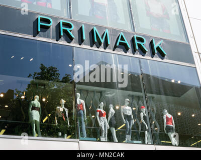 Hannover, Germany - May 7, 2018: Primark logo sign on storefront above shop window mannequins presenting their brand of fast fashion. Stock Photo