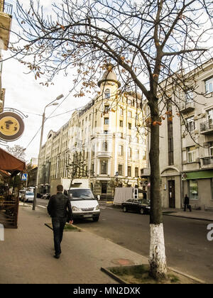 Yaroslaviv Val street, 22 of Kiev. The men are walking along the sidewalk. Cars stand on the sidelines. Stock Photo