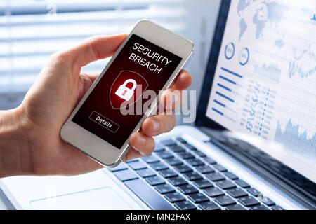 Security breach warning on smartphone screen, device infected by internet virus or malware after cyberattack by hacker, fraud alert with red padlock i Stock Photo