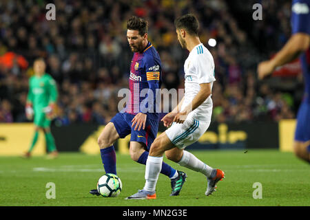 Barcelona, 6th May:  Lionel Messi of FC Barcelona drives the ball pressured by Marco Asensio of Real Madrid during the 2017/2018 LaLiga Santander Roun Stock Photo