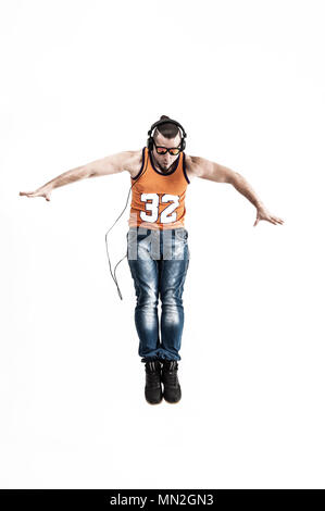 emotional and charming guy - rapper in headphones takes the danc Stock Photo