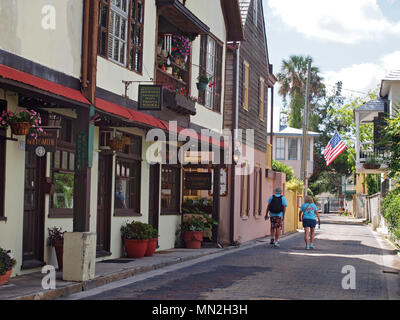 Couple strolling along Aviles Street in St. Augustine, Florida, USA, 2018, © Katharine Andriotis Stock Photo