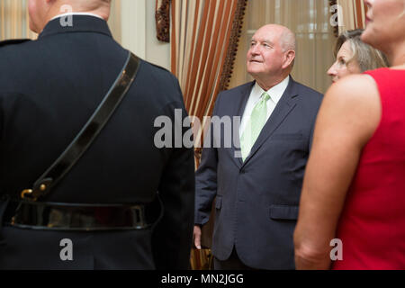 Sonny Perdue, 31st United States secretary of Agriculture, middle, attends an Evening Parade as the guest of honor with his wife, Mary Ruff Perdue, at Marine Barracks Washington, Washington, D.C., August 11, 2017. Evening parades are held as a means of honoring senior officials, distinguished citizens and supporters of the Marine Corps. (U.S. Marine Corps photo by Lance Cpl. Hailey D. Clay) Stock Photo