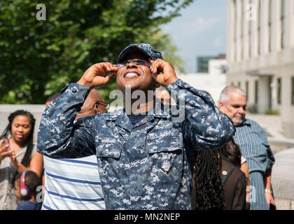 Solar eclipse is the event when the Moon passes between Earth and the Sun and blocks part of the solar disk from view at certain locations on Earth. The archival image documents observation of the Aug. 21, 2017 eclipse at Naval Support Activity Bethesda in Maryland where about 80 percent coverage occurred. Stock Photo