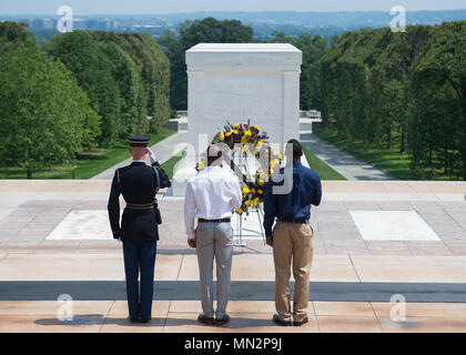 Baltimore Ravens players Keenan Reynolds, a wide receiver who graduated from the United States Naval Academy; and Otha Foster, a defensive back who served three years with the U.S. Marine Corps; participate in a wreath laying ceremony at the Tomb of the Unknown Soldier, Arlington National Cemetery, Arlington, Va., Aug. 21, 2017.  The Ravens visited the cemetery as part of the U.S. Army’s and the NFL’s community outreach program.  (U.S. Army photo by Elizabeth Fraser / Arlington National Cemetery / released) Stock Photo