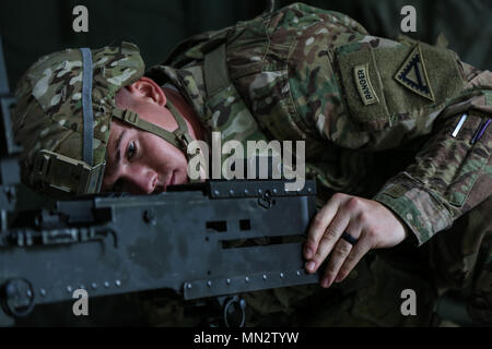 U.S. Army 1st Lt. Wesley Sickman, 1st Batallion, 4th Infantry Regiment, disassembles an M2 .50 Cal Machine Gun during the U.S. Army Europe Best Warrior Competition at the 7th Army Training Center, Grafenwoehr, Germany Aug 22, 2017. The competition runs through Aug 25 and includes a variety of physical, mental and tactical challenges designed to test every aspect of being a Soldier. (U.S. Army photo by Spc. Danielle Carver) Stock Photo