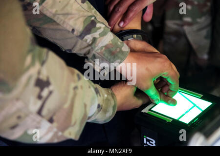 Biometrics Automated Toolset System is a United States Army platform for collecting fingerprints and biometric data during detainee operations. On August 17, 2017, Soldiers from the 400th Military Police Battalion used the system to fingerprint a mock detainee during the Combat Support Training Exercise at Fort McCoy, Wisconsin. The archival image documents the biometric data collection process. Stock Photo