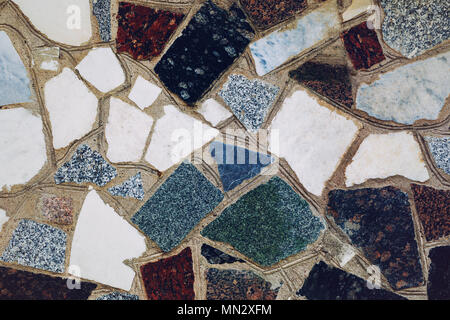 Texture of the wall from various rocks of granite and marble Stock Photo