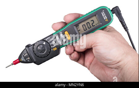 Pen type digital multimeter. Engineer's hand close-up. Electronic measuring instrument with a display, buttons and probe. Isolated on white background. Stock Photo