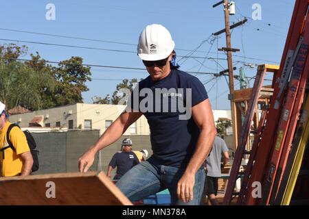 LONG BEACH, Calif. (Aug. 30, 2017) - U.S. Coast Guard, Navy and Marine Corps personnel volunteer with Habitat for Humanity at a neighborhood rebuild project in Long Beach, California during the second annual Los Angeles Fleet Week. LA Fleet Week is an opportunity for the American public to meet their Coast Guard, Navy and Marine Corps team and experience America's sea services. (U.S. Coast Guard photo by Petty Officer 1st Class Mark Barney.) Stock Photo