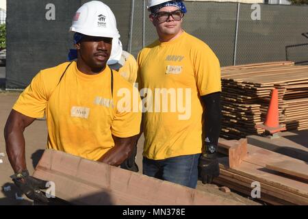 LONG BEACH, Calif. (Aug. 30, 2017) - U.S. Coast Guard, Navy and Marine Corps personnel volunteer with Habitat for Humanity at a neighborhood rebuild project in Long Beach, California during the second annual Los Angeles Fleet Week. LA Fleet Week is an opportunity for the American public to meet their Coast Guard, Navy and Marine Corps team and experience America's sea services. (U.S. Coast Guard photo by Petty Officer 1st Class Mark Barney.) Stock Photo