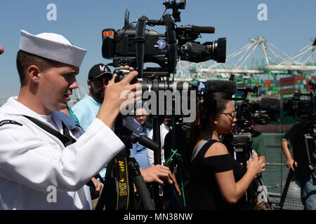 170829-N-UK333-0051 LOS ANGELES (August 29, 2017) Mass Communication Specialist 2nd Class Derek Harkins, assigned to Commander, Submarine Squadron U.S. Pacific Fleet Representative West Coast, along with local news media outlets, attend a press conference on board the Battleship Iowa Museum in support of the second annual Los Angeles Fleet Week. LA Fleet Week is an opportunity for the American public to meet their Navy, Marine Corps and Coast Guard team and experience America's sea services. During fleet week, service members will participate in various community service events, showcase capab Stock Photo