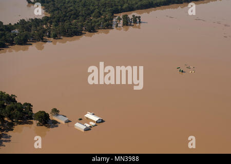 A photograph of houses submerged by floodwaters in 1929, capturing the ...