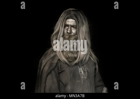 long haired man made of gray make up; mythological bearded man Stock Photo