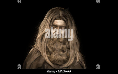 long haired man made of gray make up; mythological bearded man Stock Photo