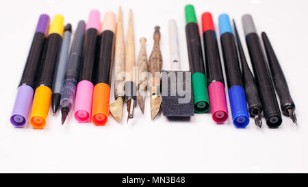 Paper, ink and calligraphy pens. Lettering workshop details. Banner Concept, Design Copy Space Supplies Top View Flat Lay Stock Photo