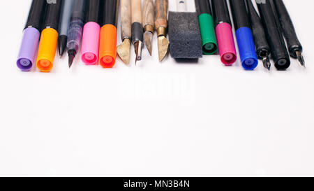 Paper, ink and calligraphy pens. Lettering workshop details. Banner Concept, Design Copy Space Supplies Top View Flat Lay Stock Photo