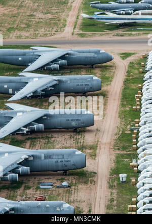 Retired C-5 Galaxies sit at the 309th Aerospace Maintenance and Regeneration Group’s Aircraft and Missile Storage and Maintenance Facility on Davis-Monthan AFB, Ariz, Aug 2, 2017. The AMARG is the largest aircraft storage and preservation facility in the world. (U.S. Force Photo by Staff Sgt. Perry Aston) Stock Photo