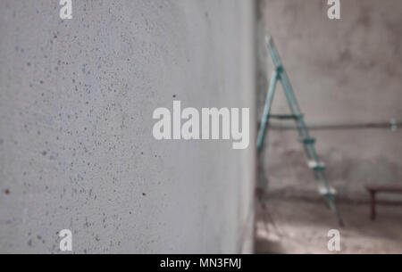 Ladder in a empty unfinished room. Apartment interior remodel Stock Photo