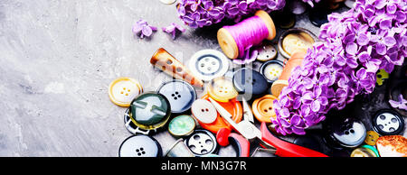 Set buttons from clothes, threads and scissors.Sewing accessories. Stock Photo
