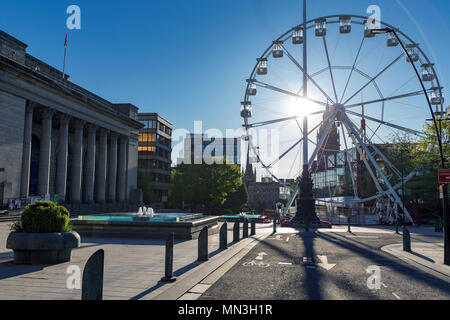 Sheffield City Hall and a temporary observation wheel on a sunny day in May, with completely blue skies and no clouds. Sheffield, South Yorkshire, UK. Stock Photo