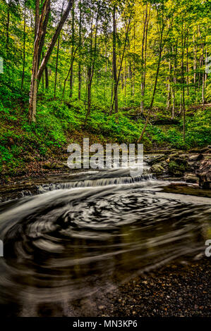 A small waterfall just downstream from Blue Hen Falls in Cuyahoga Valley National Park Ohio.  The swirling water makes a circular pattern.