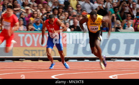 LONDON, ENGLAND - AUGUST 12: Usain Bolt of Jamaica in leg 4 starts his run to collect the baton from Micheal Campbell during the Men's 4x100 Metres Relay Heats during day nine of the 16th IAAF World Athletics Championships London 2017 at The London Stadium on August 12, 2017 in London, United Kingdom.  --- Image by © Paul Cunningham Stock Photo