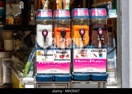Florence, Italy - May 4, 2018 - Frozen fruit slush granita drinks on display for sale in hot weather Stock Photo